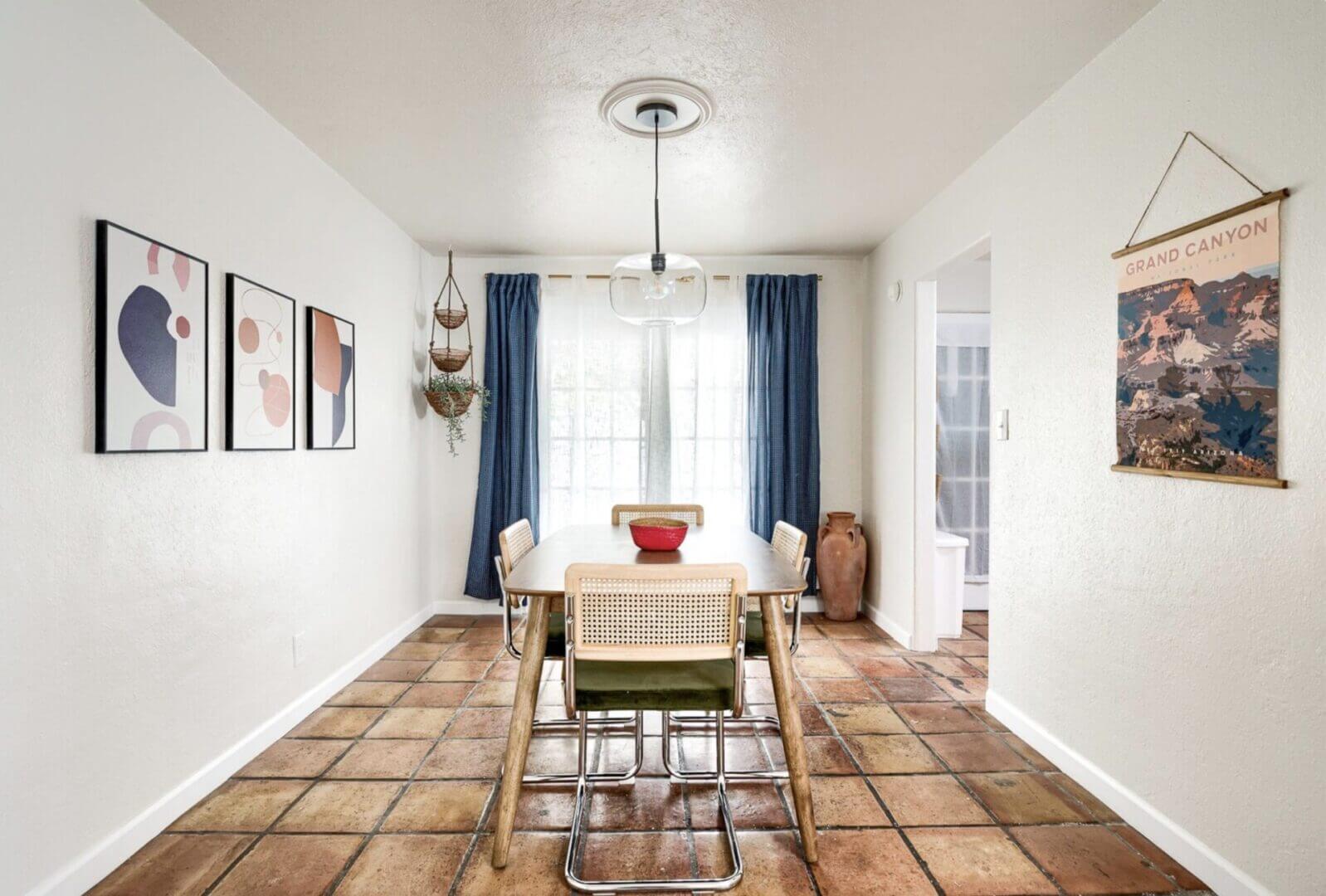 Bright dining room with modern chairs and a wooden table.